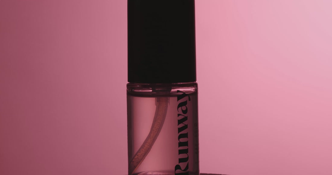 Video promoting Christian Siriano Runway First Look Gripping Glow Primer, highlighting clear bottle design and narration about skin-first formula with witch hazel, microalgae, and squalane.